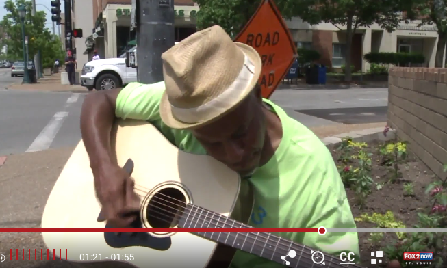 Delmar Loop street musician is gifted a new guitar